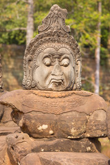 Fototapeta na wymiar Statue of ancient khmer warrior head at Angkor Wat