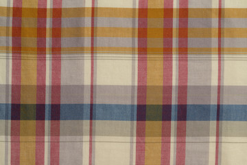 Background of Yellow,Blue,and Red Plaid Cloth Shot in Studio 
