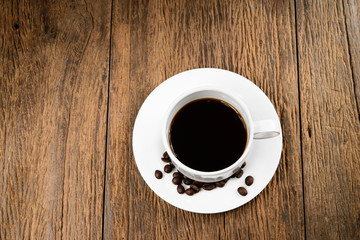 Coffee cup on wood background