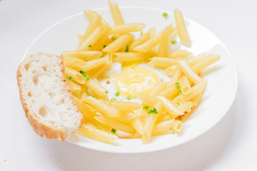 Plate with pasta and fried eggs
