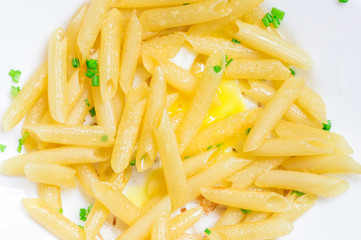Italian penne pasta dish with greens and eggs
