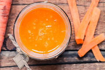 Carrot fresh juice in a glass jar