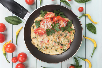 Omelet with cheese and cherry tomato