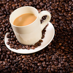 coffee cup on coffee bean