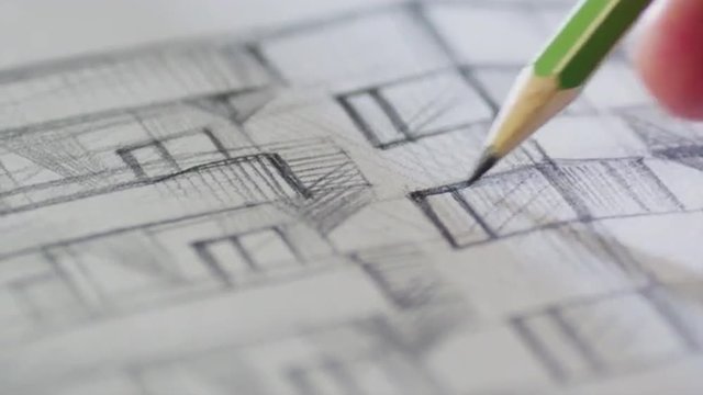 Architect is Sketching a Building on Paper