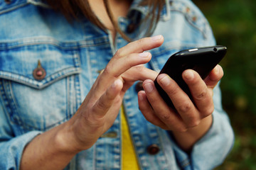 Woman using smart phone outside