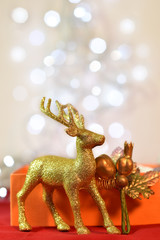 Golden Stags and Christmas decorations. Background bokeh