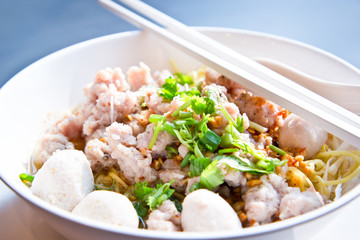 bowl of egg noodles with minced prok and fish balls