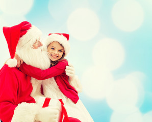smiling little girl with santa claus
