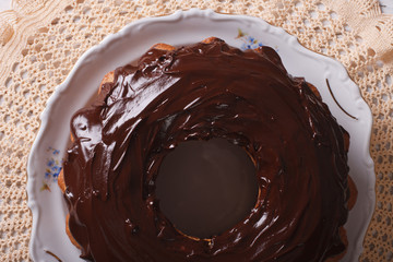 fancy bread cake with chocolate icing close-up. horizontal top view
