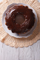 fancy bread cake with chocolate icing. Vertical top view
