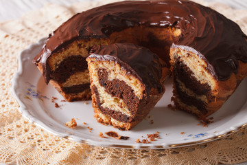 marble cake with chocolate cut on a plate. horizontal
