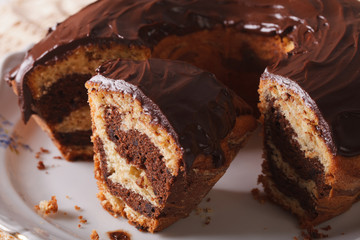 marble cake sliced into pieces close-up on a plate. horizontal
