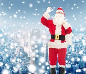 man in costume of santa claus with bag