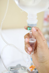 Close up saline IV drip for patient and Infusion pump in hospita