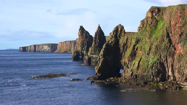 Establishing shot of the beautiful Duncansby Head sea stacks in Northern Scotland.