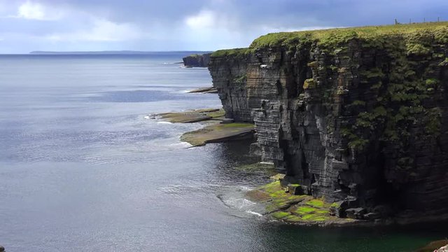 Establishing shot of the beautiful green coast of Scotland or Ireland.