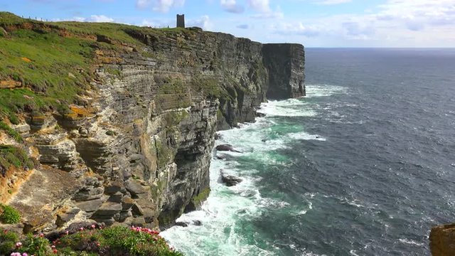 Establishing shot of the beautiful rugged ocean coast of Scotland or Ireland.
