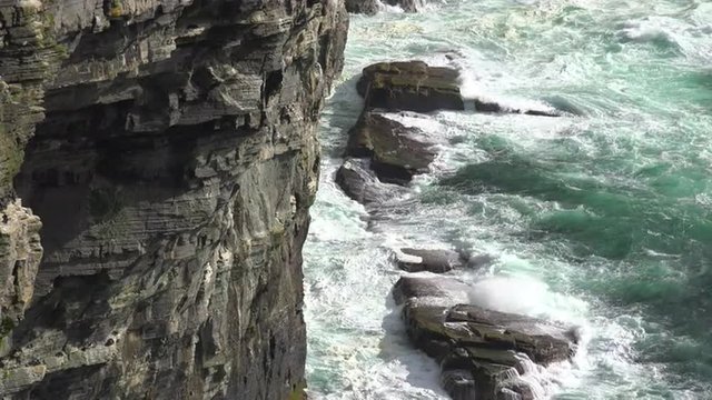 Establishing shot of the beautiful rugged ocean coast of Scotland or Ireland.