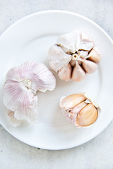 Fototapeta na wymiar Garlic on white plate