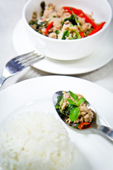 spicy pork with hot basil on stream jasmine rice