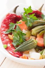 Vegan meal with okra, bell pepper and vegetable