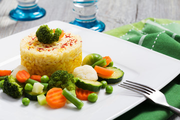Portion of risotto with vegetables.