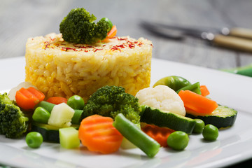 Portion of risotto with vegetables.