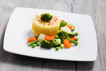 Portion of risotto with vegetables.