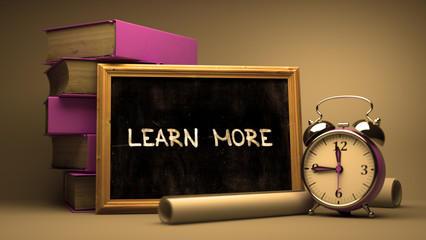 Learn More - Chalkboard with Hand Drawn Text.