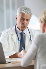 Doctor having consultation with patient in office