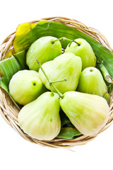 green rose apple on the basket
