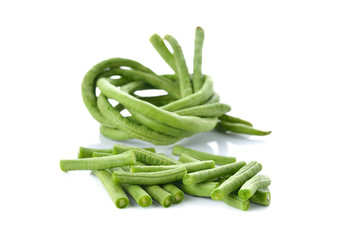 whole and portion cut yardlong beans on white background