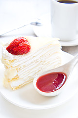 Crape cake with strawberry sauce