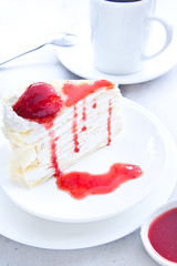 Crape cake with strawberry sauce