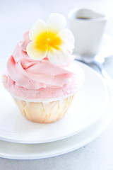 Cup cake with flower butter cream icing