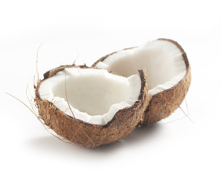 coconut cut in half on a white background with a soft shadow