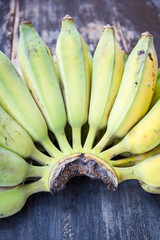 Cultivated bananas on wooden table