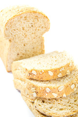 Slices of finest organic bread on white background, isolated