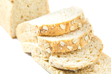 Slices of finest organic bread on white background, isolated