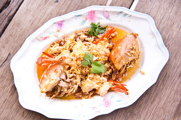 Stir shrimps with garlic on plate ,Thai seafood