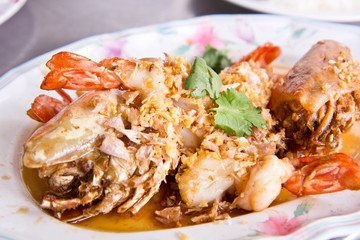 Stir shrimps with garlic on plate ,Thai seafood