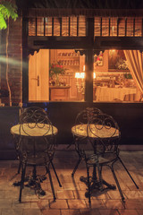 Night view of cozy restaurant in Bruges, Belgium