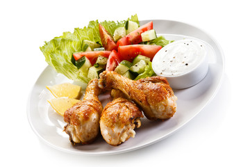 Roasted chicken drumsticks and vegetables