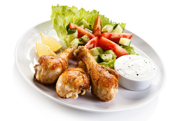 Roasted chicken drumsticks and vegetables