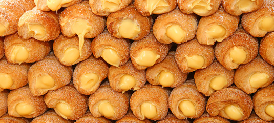 many cakes and cannoli cream for sale in pastry