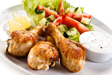 Roasted chicken drumsticks and vegetables