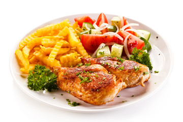 Fried chicken fillet, chips and vegetable salad 