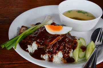 barbecue pork dressing sweet sauce and boiled egg