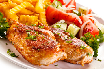 Fried chicken fillet, chips and vegetable salad 